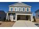 Charming two-story home featuring a spacious two-car garage and classic architectural details at 147 Little Crk Dr, Lillington, NC 27546