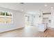 Open living area with bright interiors, modern kitchen with stylish island and stainless steel appliances at 147 Little Crk Dr, Lillington, NC 27546