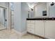 Bathroom featuring a vanity with a granite countertop, white cabinetry, and a glass-enclosed shower at 1605 Hunting Ridge Rd, Raleigh, NC 27615