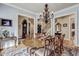 Spacious dining area with hardwood floors and views to other parts of the house at 1605 Hunting Ridge Rd, Raleigh, NC 27615