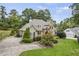 Charming two-story home featuring a stone facade and beautifully landscaped front yard at 1605 Hunting Ridge Rd, Raleigh, NC 27615