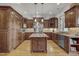 Gourmet kitchen with stainless steel appliances, custom cabinetry, and granite countertops at 1605 Hunting Ridge Rd, Raleigh, NC 27615