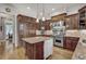 Well-equipped kitchen with a center island, custom cabinets, and modern appliances at 1605 Hunting Ridge Rd, Raleigh, NC 27615