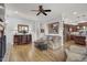Comfortable living room with hardwood floors and a view into the kitchen at 1605 Hunting Ridge Rd, Raleigh, NC 27615