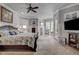 Spacious main bedroom with natural light and a decorative ceiling fan at 1605 Hunting Ridge Rd, Raleigh, NC 27615