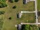 A birds eye view of a charming home situated on a sprawling lot, enhanced by verdant landscaping at 164 Tillburg Ln, Hurdle Mills, NC 27541