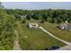 Aerial view of a beautiful home on a large, well-manicured lot, showcasing its serene setting at 164 Tillburg Ln, Hurdle Mills, NC 27541