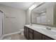 Bathroom features double sinks, a large mirror, and a tiled shower at 164 Tillburg Ln, Hurdle Mills, NC 27541