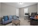 Well-lit bedroom with comfortable seating area and work space, illuminated by natural light at 164 Tillburg Ln, Hurdle Mills, NC 27541