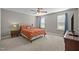 Bedroom with a ceiling fan, plush carpet, natural light, and neutral colored walls at 164 Tillburg Ln, Hurdle Mills, NC 27541