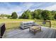 Relaxing deck with outdoor seating and scenic backyard views, great for entertaining and enjoying nature at 164 Tillburg Ln, Hurdle Mills, NC 27541