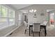 Dining room boasts bright natural light, neutral walls, carpet and easy access to the exterior at 164 Tillburg Ln, Hurdle Mills, NC 27541