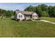 Charming home with well-maintained landscaping and a welcoming front porch, offering curb appeal at 164 Tillburg Ln, Hurdle Mills, NC 27541