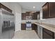 Modern kitchen features stainless steel appliances, granite countertops, and ample cabinet space at 164 Tillburg Ln, Hurdle Mills, NC 27541