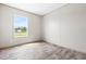 Bright bedroom featuring wood-look flooring and a window offering a view of the outdoors at 17 Star Dust Ln, Selma, NC 27576