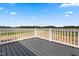 The deck has a view of the nearby fields at 17 Star Dust Ln, Selma, NC 27576