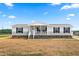 Attractive home with black-trimmed windows and a well-maintained lawn, set under a blue sky at 17 Star Dust Ln, Selma, NC 27576