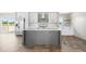 Open-concept kitchen with stainless steel appliances, center island, and sliding doors to the deck at 17 Star Dust Ln, Selma, NC 27576