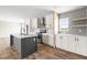 Beautiful kitchen featuring stainless steel appliances, gray backsplash, and a center island with a sink at 17 Star Dust Ln, Selma, NC 27576