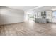 Spacious living area with modern floors, open to kitchen, and sliding door access at 17 Star Dust Ln, Selma, NC 27576