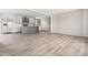 Expansive living area adjacent to a modern kitchen with stainless steel appliances and center island at 17 Star Dust Ln, Selma, NC 27576