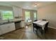 Open kitchen and dining area with updated appliances and charming decor at 1708 Sundial Pl, Raleigh, NC 27610