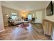 Bright and airy living room featuring elegant decor and herringbone floors at 1708 Sundial Pl, Raleigh, NC 27610