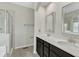 Luxurious bathroom with double vanity, modern fixtures, and tiled shower at 1844 Austin Ridge Pkwy, Wake Forest, NC 27587