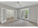A spacious bedroom with a ceiling fan and access to other rooms at 1844 Austin Ridge Pkwy, Wake Forest, NC 27587