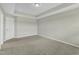 This bedroom features plush carpeting, a white door, and ample natural light at 1844 Austin Ridge Pkwy, Wake Forest, NC 27587