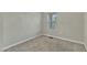 Clean bedroom with neutral walls and carpet showcases a simple and versatile layout for a relaxing retreat at 1844 Austin Ridge Pkwy, Wake Forest, NC 27587