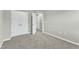 Bright bedroom features neutral walls and carpet with natural light and ample closet space, ready to be styled at 1844 Austin Ridge Pkwy, Wake Forest, NC 27587