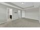 Neutral bedroom features plush carpeting, ensuite bathroom, and walk-in closet at 1844 Austin Ridge Pkwy, Wake Forest, NC 27587