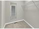 Empty closet with shelving and neutral walls showing a clean, organized space, ready for storage at 1844 Austin Ridge Pkwy, Wake Forest, NC 27587