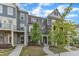 A charming townhouse with brick and siding, complemented by a well-manicured lawn at 1844 Austin Ridge Pkwy, Wake Forest, NC 27587