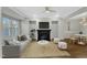 Cozy living room with fireplace, hardwood floors, neutral color scheme, and modern furnishings at 1844 Austin Ridge Pkwy, Wake Forest, NC 27587