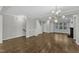 Spacious living room boasts hardwood floors, modern lighting, and a cozy fireplace at 1844 Austin Ridge Pkwy, Wake Forest, NC 27587