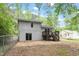 View of the backyard, deck with stairs, and exterior of the house at 1903 Meadowbrook St, Sanford, NC 27330