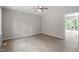 Bedroom features a ceiling fan and overlooks the backyard deck through glass sliding doors at 1903 Meadowbrook St, Sanford, NC 27330