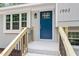 Close up view of blue front door and new staircase at 1903 Meadowbrook St, Sanford, NC 27330