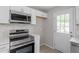Contemporary kitchen with stainless steel appliances, and access to backyard at 1903 Meadowbrook St, Sanford, NC 27330