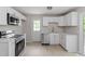 Modern kitchen features stainless steel appliances, white cabinets, countertops, and subway tile backsplash at 1903 Meadowbrook St, Sanford, NC 27330