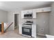 Modern kitchen showcasing stainless steel appliances, white cabinetry, and stylish backsplash at 1903 Meadowbrook St, Sanford, NC 27330