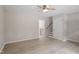 Spacious living room with views of staircase and an entrance to the backyard at 1903 Meadowbrook St, Sanford, NC 27330