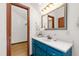 Bathroom featuring a vanity with bright blue cabinets at 1915 Redding Ln, Durham, NC 27712
