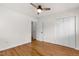Spacious bedroom with hardwood floors and a ceiling fan at 1915 Redding Ln, Durham, NC 27712