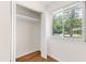 Bedroom closet with shelving near a bright window at 1915 Redding Ln, Durham, NC 27712
