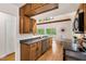 Well-lit kitchen with wooden cabinets and modern appliances, next to the dining area at 1915 Redding Ln, Durham, NC 27712