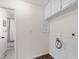 Clean laundry room with wainscoting and space for washer and dryer at 1915 Redding Ln, Durham, NC 27712