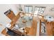 Overhead shot of a stylish living room with an open layout, hardwood floors, and modern furniture at 1915 Redding Ln, Durham, NC 27712